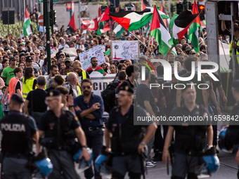 Members of the Palestinian student movement in Italy participate in a demonstration in the center of Rome to show their support for the Pale...