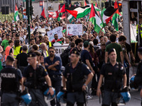 Members of the Palestinian student movement in Italy participate in a demonstration in the center of Rome to show their support for the Pale...