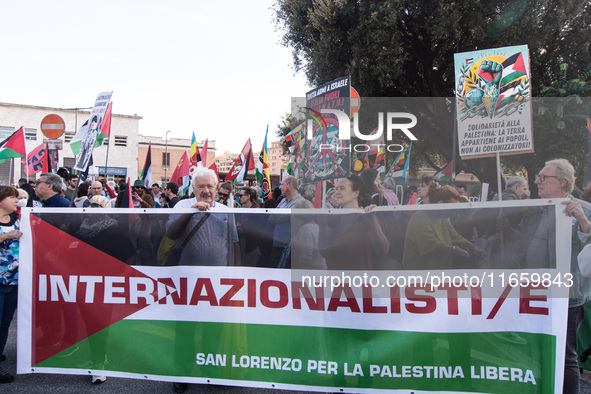 Members of the Palestinian student movement in Italy participate in a demonstration in the center of Rome to show their support for the Pale...