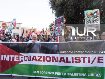 Members of the Palestinian student movement in Italy participate in a demonstration in the center of Rome to show their support for the Pale...