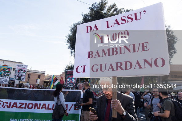 Members of the Palestinian student movement in Italy participate in a demonstration in the center of Rome to show their support for the Pale...