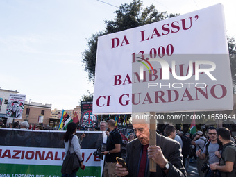 Members of the Palestinian student movement in Italy participate in a demonstration in the center of Rome to show their support for the Pale...