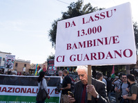 Members of the Palestinian student movement in Italy participate in a demonstration in the center of Rome to show their support for the Pale...