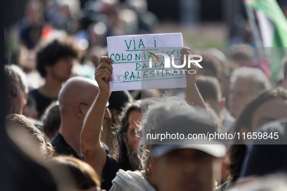 Members of the Palestinian student movement in Italy participate in a demonstration in the center of Rome to show their support for the Pale...