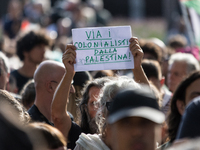 Members of the Palestinian student movement in Italy participate in a demonstration in the center of Rome to show their support for the Pale...