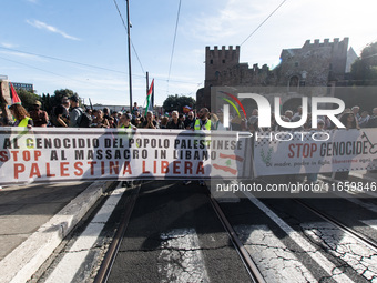 Members of the Palestinian student movement in Italy participate in a demonstration in the center of Rome to show their support for the Pale...