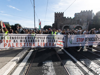 Members of the Palestinian student movement in Italy participate in a demonstration in the center of Rome to show their support for the Pale...