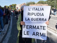 Members of the Palestinian student movement in Italy participate in a demonstration in the center of Rome to show their support for the Pale...