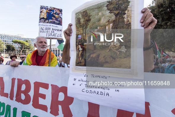 Members of the Palestinian student movement in Italy participate in a demonstration in the center of Rome to show their support for the Pale...