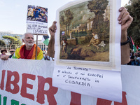 Members of the Palestinian student movement in Italy participate in a demonstration in the center of Rome to show their support for the Pale...