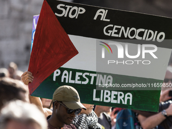 Members of the Palestinian student movement in Italy participate in a demonstration in the center of Rome to show their support for the Pale...