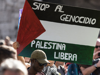 Members of the Palestinian student movement in Italy participate in a demonstration in the center of Rome to show their support for the Pale...