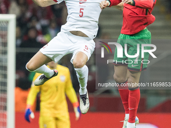 Jan Bednarek , Cristiano Ronaldo  during UEFA Nations League match Poland vs Portugal in Warsaw Poland on 12 October 2024. (