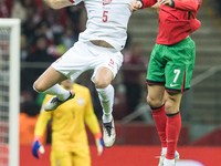 Jan Bednarek , Cristiano Ronaldo  during UEFA Nations League match Poland vs Portugal in Warsaw Poland on 12 October 2024. (