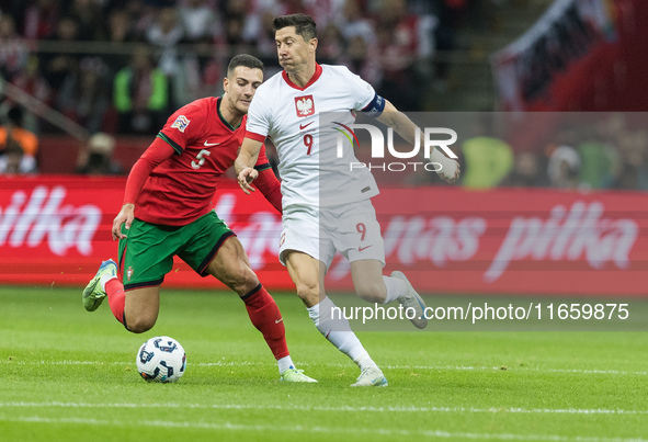 Diogo Dalot , Robert Lewandowski  during UEFA Nations League match Poland vs Portugal in Warsaw Poland on 12 October 2024. 