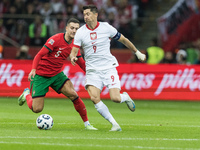 Diogo Dalot , Robert Lewandowski  during UEFA Nations League match Poland vs Portugal in Warsaw Poland on 12 October 2024. (