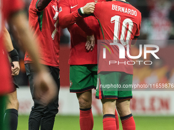 A fan takes a picture with Cristiano Ronaldo , Bernardo Silva  during UEFA Nations League match Poland vs Portugal in Warsaw Poland on 12 Oc...