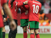 A fan takes a picture with Cristiano Ronaldo , Bernardo Silva  during UEFA Nations League match Poland vs Portugal in Warsaw Poland on 12 Oc...