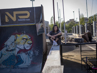 An Iranian participant waits to perform in a freestyle bicycle competition at the Navid BMX Bike Park in southern Tehran, Iran, on October 1...