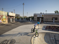 An Iranian participant warms up before taking part in a freestyle bicycle competition at the Navid BMX Bike Park in southern Tehran, Iran, o...