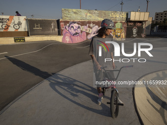 An Iranian participant sits on his BMX bike before taking part in a freestyle bicycle competition at the Navid BMX Bike Park in southern Teh...