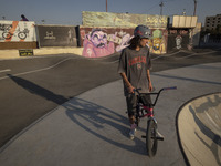 An Iranian participant sits on his BMX bike before taking part in a freestyle bicycle competition at the Navid BMX Bike Park in southern Teh...