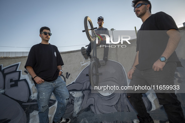 Iranian participants pose for a photograph before taking part in a freestyle bicycle competition at the Navid BMX Bike Park in southern Tehr...