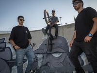 Iranian participants pose for a photograph before taking part in a freestyle bicycle competition at the Navid BMX Bike Park in southern Tehr...