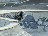 An Iranian participant warms up before taking part in a freestyle bicycle competition at the Navid BMX Bike Park in southern Tehran, Iran, o...