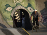 An Iranian participant rides a BMX bike in a freestyle bicycle competition at the Navid BMX Bike Park in southern Tehran, Iran, on October 1...