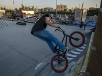 An Iranian participant performs in a freestyle bicycle competition at the Navid BMX Bike Park in southern Tehran, Iran, on October 11, 2024....