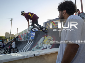 An Iranian participant performs in a freestyle bicycle competition at the Navid BMX Bike Park in southern Tehran, Iran, on October 11, 2024....