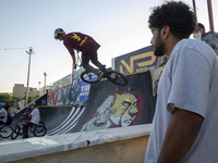 An Iranian participant performs in a freestyle bicycle competition at the Navid BMX Bike Park in southern Tehran, Iran, on October 11, 2024....