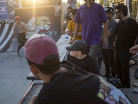 Iranian youths watch a freestyle bicycle competition at the Navid BMX Bike Park in southern Tehran, Iran, on October 11, 2024. (