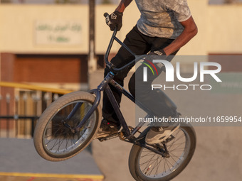 An Iranian participant performs in a freestyle bicycle competition at the Navid BMX Bike Park in southern Tehran, Iran, on October 11, 2024....