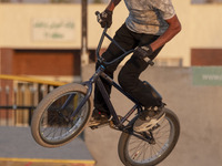 An Iranian participant performs in a freestyle bicycle competition at the Navid BMX Bike Park in southern Tehran, Iran, on October 11, 2024....