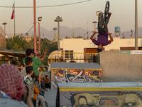 An Iranian participant performs in a freestyle bicycle competition at the Navid BMX Bike Park in southern Tehran, Iran, on October 11, 2024....