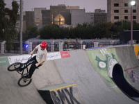 An Iranian participant performs in a freestyle bicycle competition at the Navid BMX Bike Park in southern Tehran, Iran, on October 11, 2024....