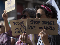 A person holds a banner during a demonstration supporting Palestine in Lisbon, Portugal, on October 12, 2024. (