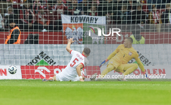 Jan Bednarek  scores an own goal, Lukasz Skorupski  during UEFA Nations League match Poland vs Portugal in Warsaw Poland on 12 October 2024....