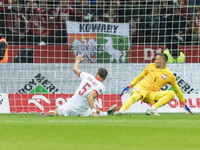 Jan Bednarek  scores an own goal, Lukasz Skorupski  during UEFA Nations League match Poland vs Portugal in Warsaw Poland on 12 October 2024....