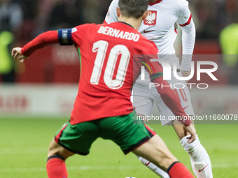 Bernardo Silva , Piotr Zielinski  during UEFA Nations League match Poland vs Portugal in Warsaw Poland on 12 October 2024. (