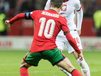 Bernardo Silva , Piotr Zielinski  during UEFA Nations League match Poland vs Portugal in Warsaw Poland on 12 October 2024. (