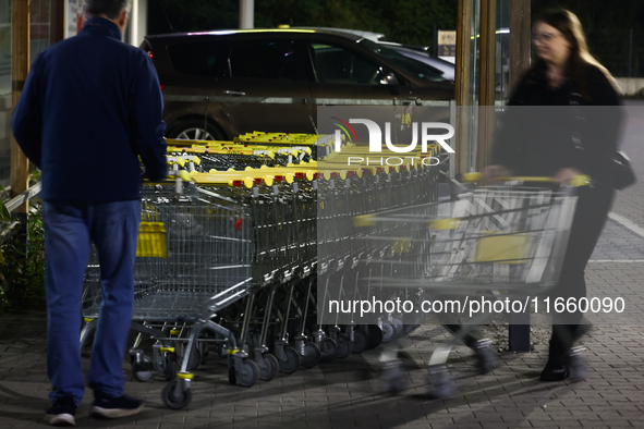 Shopping trolleys are seen near the shop in Inwald, Poland on October 12, 2024. 