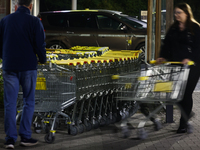 Shopping trolleys are seen near the shop in Inwald, Poland on October 12, 2024. (