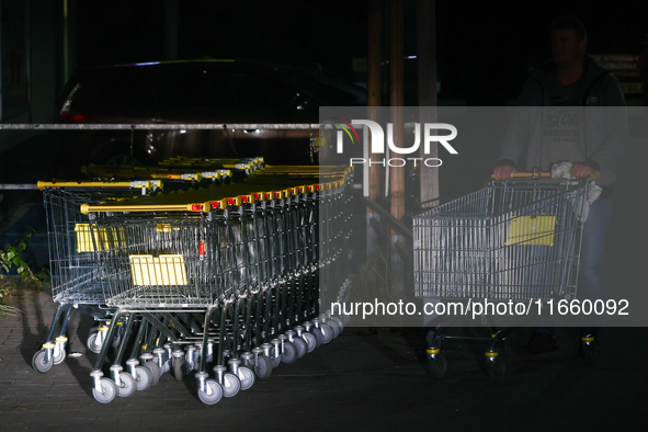 Shopping trolleys are seen near the shop in Inwald, Poland on October 12, 2024. 