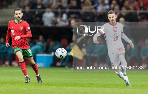 Bernardo Silva , Sebastian Szymanski  during UEFA Nations League match Poland vs Portugal in Warsaw Poland on 12 October 2024. 