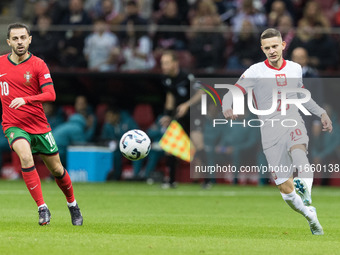 Bernardo Silva , Sebastian Szymanski  during UEFA Nations League match Poland vs Portugal in Warsaw Poland on 12 October 2024. (