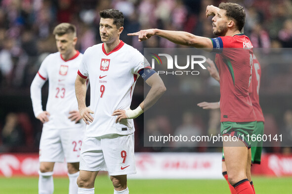 Robert Lewandowski , Ruben Dias  during UEFA Nations League match Poland vs Portugal in Warsaw Poland on 12 October 2024. 