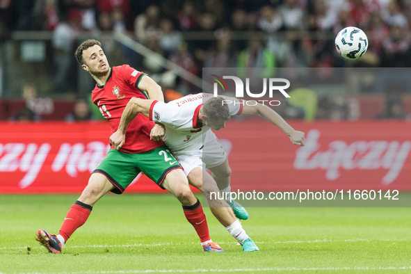 Diogo Jota , Pawel Dawidowicz  during UEFA Nations League match Poland vs Portugal in Warsaw Poland on 12 October 2024. 